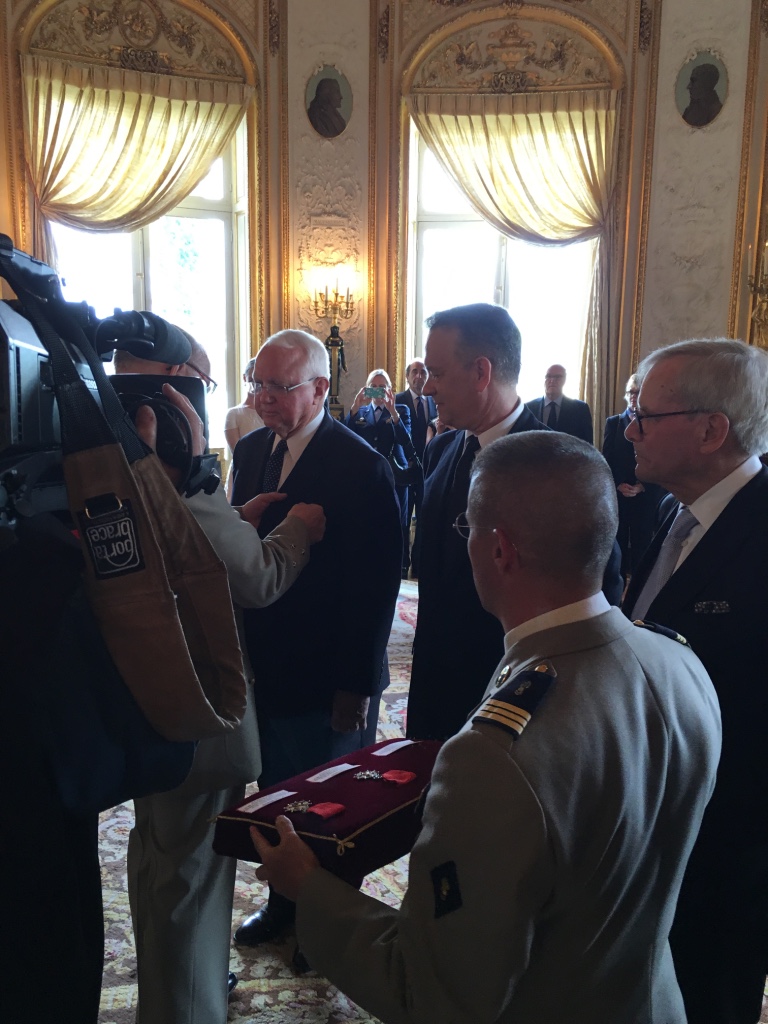 Dr. Mueller receiving the Legion of Honor